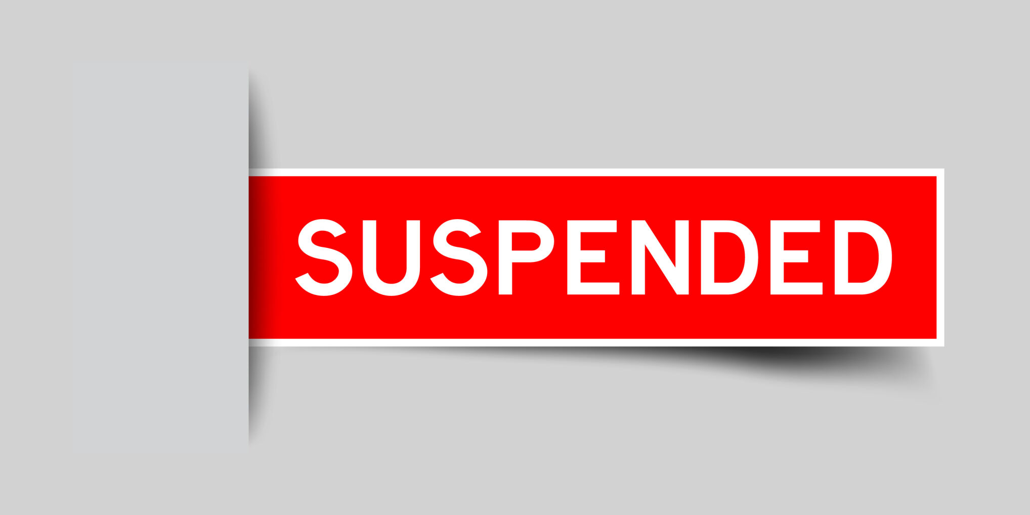 Inserted Red Color Sticker Label With Word Suspended On Gray Background